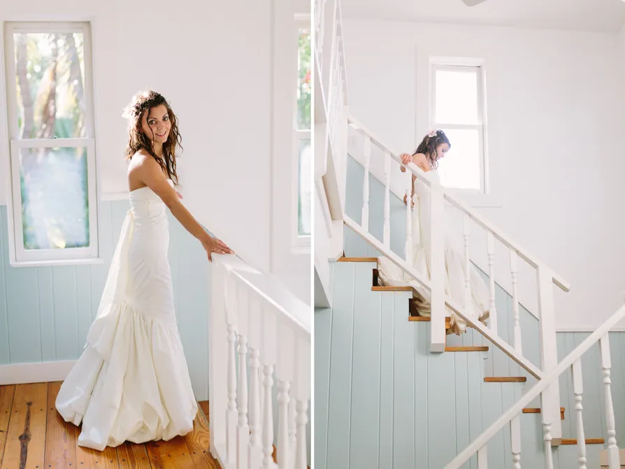 Bride in a white dress smiling by a window and walking upstairs.