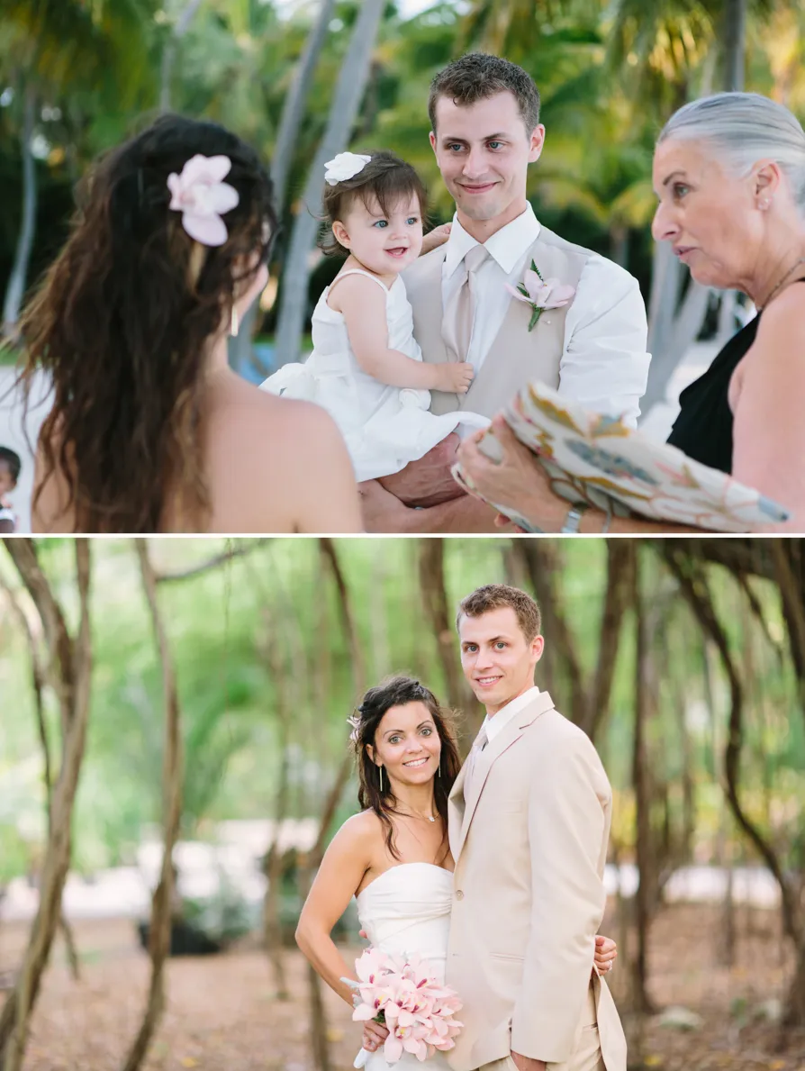 A couple exchanges wedding rings in a ceremony with a child present.