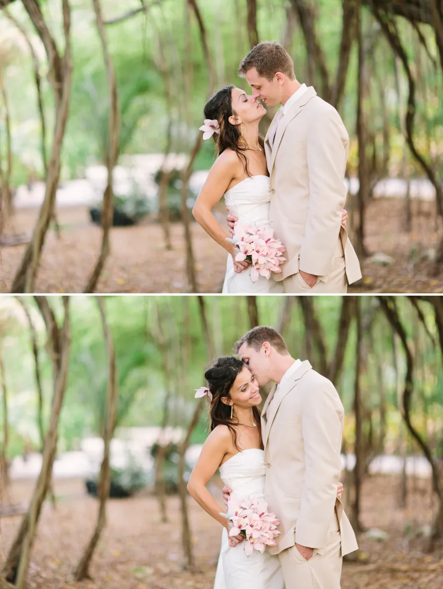 Couple sharing a romantic kiss in a serene outdoor setting.